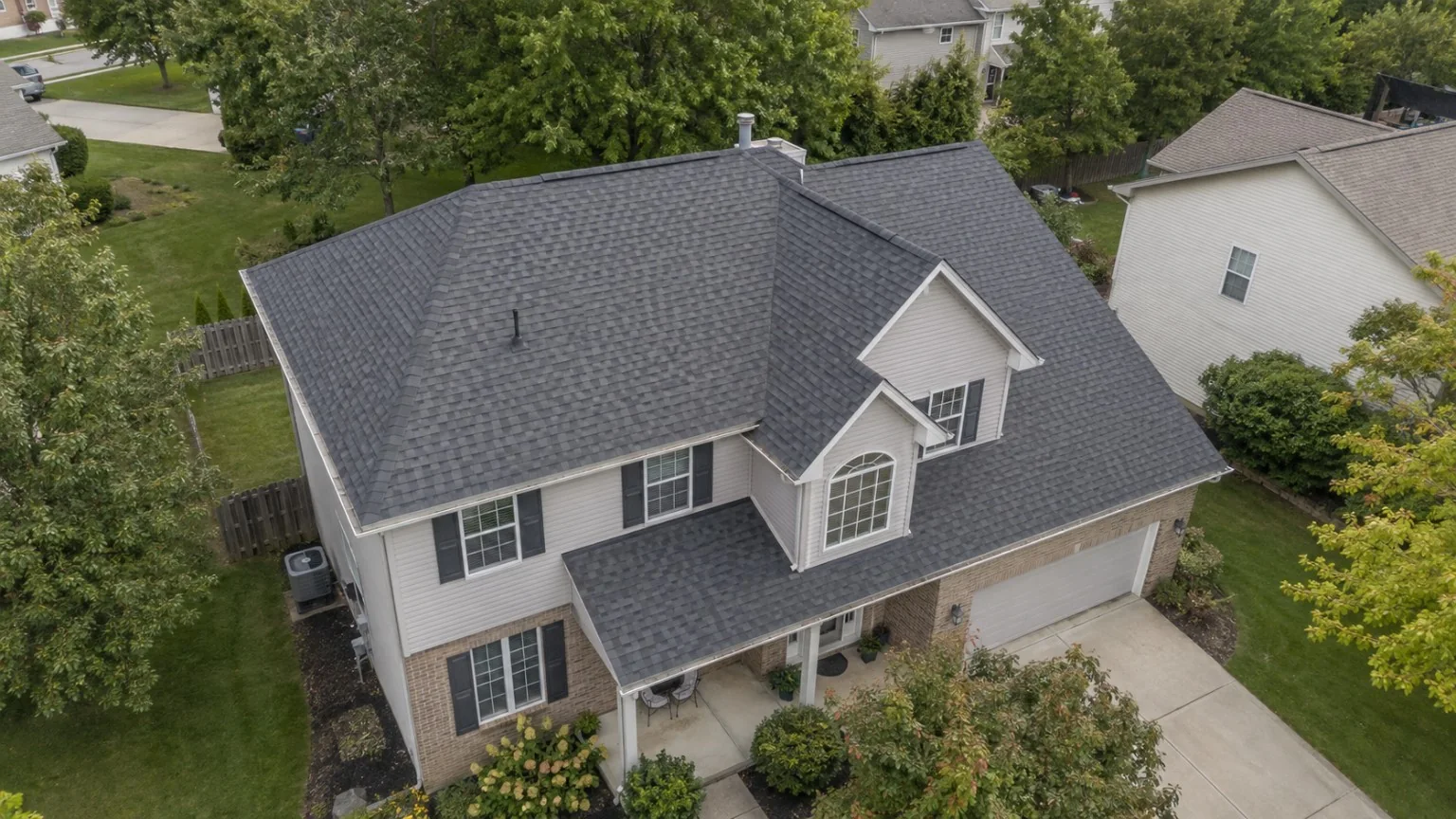Aerial view of a completed architectural shingle roof